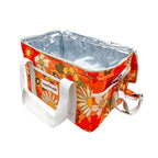 A rectangular cooler bag with a retro orange floral pattern, white canvas handles, and a silver foil-lined interior, shown on a plain white background.